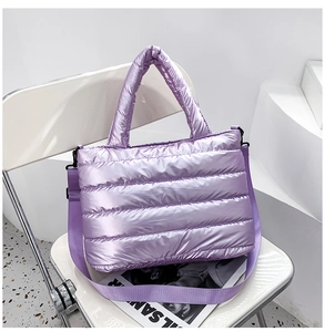 Detail of lavender quilted puffer tote bag featuring glossy finish and detachable strap