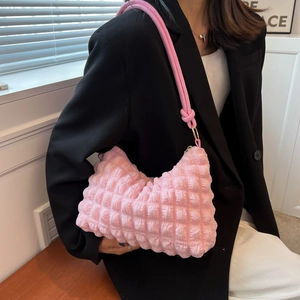 Pink bubble fabric shoulder bag with soft textured waffle pleats and knot detail