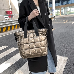 Quilted metallic gold tote bag with large capacity and detachable black shoulder strap