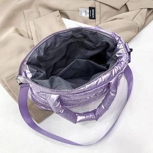Top view of purple padded tote bag interior with gray lining and zipper pocket