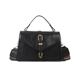 Vintage black crossbody bag with golden buckle and ethnic print woven wide strap