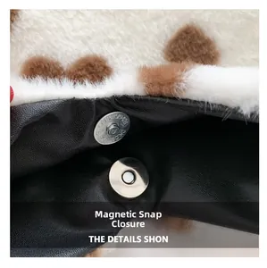 Detailed macro view of the magnetic closure on a fluffy heart-shaped shoulder bag