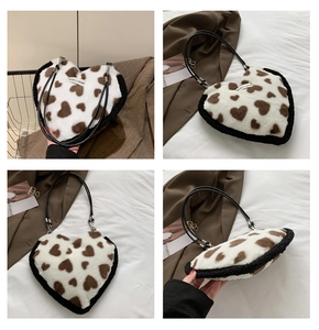 Detailed views of a heart-shaped plush shoulder bag with brown heart patterns and black trim