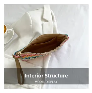 Internal structure of rainbow woven clutch featuring organized side pocket and metal zipper