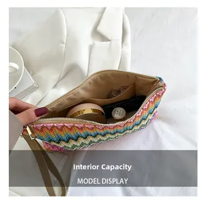 Detailed view of the rainbow chevron crochet clutch showing inner lining and large capacity