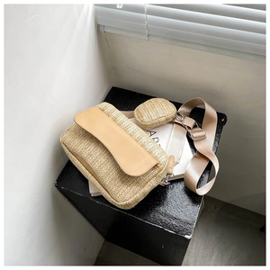 Detail view of woven crossbody bag set with nylon strap and small round coin purse