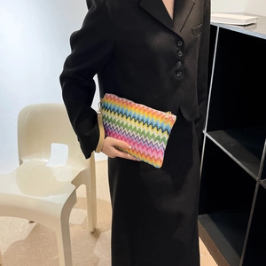 Rainbow woven clutch bag with zigzag patterns and leather wristlet strap