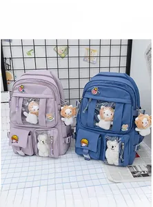 Detail of Harajuku style Ita bag featuring large transparent PVC window and plush charms