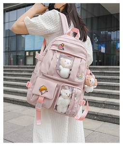 Pink student backpack with transparent display window for plush toys and cute badges