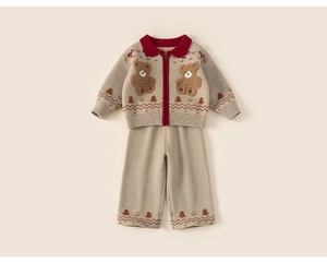 Detail of oatmeal knit sweater set featuring red collar and cute plush bear patches