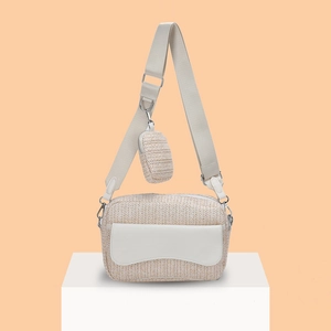 Minimalist woven beige crossbody bag with adjustable wide strap and mini coin purse