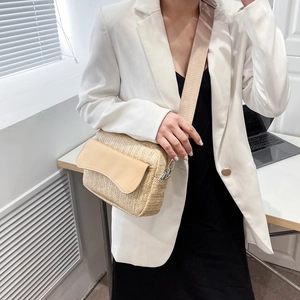 Minimalist straw woven crossbody bag with beige leather flap and wide fabric strap for women