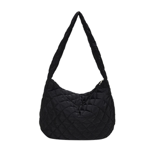 Black quilted crescent tote bag with oversized padded shoulder strap and soft nylon finish