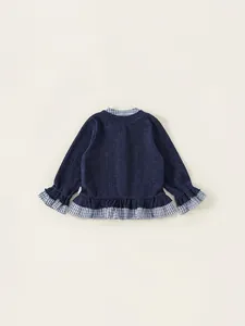 Girls sweet navy knit long sleeve top with blue checkered ruffle hem and bow detail