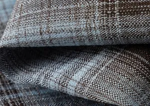 Detail of navy and tan checkered fabric with natural texture for boys' formal suit