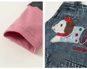 Close-up of cartoon dog embroidery and soft cotton cuffs on a kids clothing set