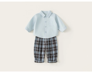 Detailed flat lay of boys light blue cotton shirt and brown plaid checkered trousers