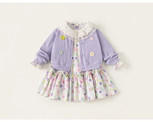 Close-up of girls purple knit cardigan with lace collar and floral dress details