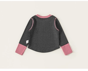 Detail view of heather gray knit top with contrast pink stitching and soft fabric texture