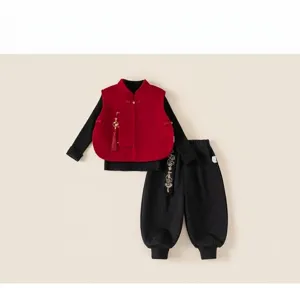 Close-up of red Chinese New Year vest with tassel and Good Luck embroidery on pants