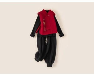 Detailed flat lay of children's New Chinese style red vest with tassels and embroidered pants