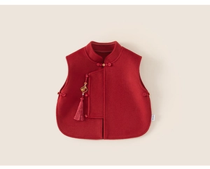 Detailed view of red Chinese New Year vest with traditional knot buttons and tassel pendant