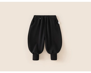 Detail of kids black harem pants with elastic waist and ribbed cuffs in soft cotton