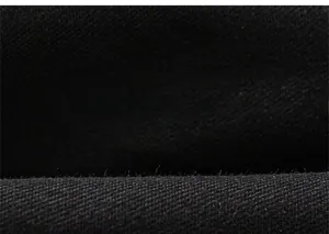 Close-up detail showing breathable black cotton fabric texture for boys' casual pants