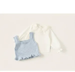 Detail of girls floral lace collar shirt and light blue knitted vest set in soft cotton
