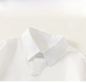 Detail shot of the white cotton shirt collar and matching resin buttons for kids