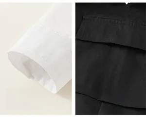 Detailed view of comfortable white shirt cuffs and a black cargo pocket with flap design