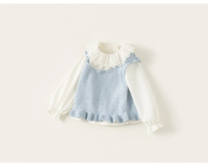 Detail of baby girl two-piece set featuring lace collar shirt and blue knit vest