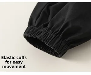 Detail of black cotton jogger pants with elastic cuffs for comfortable movement
