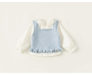 Detail of girls' white lace collar shirt paired with light blue knitted hollow vest