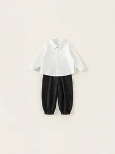Boys two-piece casual clothing set with white long-sleeve shirt and black cargo pants