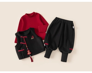 Detail showing red turtle neck shirt and black fleece vest with traditional knot buttons