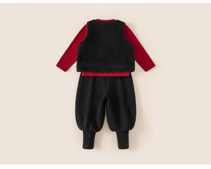 Detailed flat lay of children's 3-piece set with red knit shirt and black fleece vest
