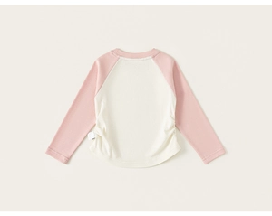 Detailed view of kids raglan sleeve t-shirt with soft cotton fabric and side gathers