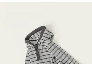 Detail of grey striped hooded sweatshirt with button neckline and soft knit fabric