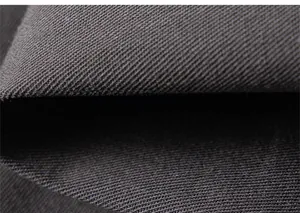 Close-up of deep gray twill fabric texture showing weave detail and material thickness