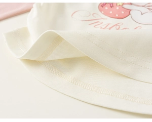 Close-up of baby t-shirt hem featuring double-needle stitching and strawberry print