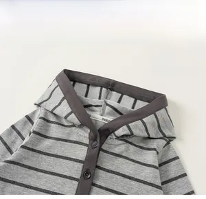 Detail of grey striped toddler hoodie neck with dark grey trim and functional buttons