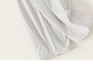 Detailed close-up of high-density fabric stitching on kids minimalist cargo trousers