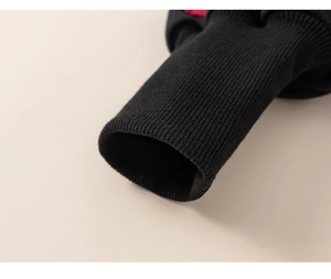 Close-up of black ribbed cuffs showing premium knitting texture and durable stitching