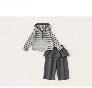 Detail view of girls striped hooded sweatshirt and grey wide leg trousers set