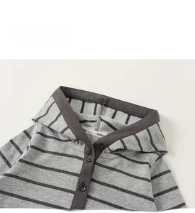 Detail of grey striped girls hoodie neckline with buttons and premium stitching