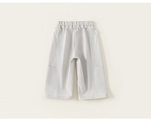 Detail of children's wide-leg cargo pants with elastic waistband and decorative stitching