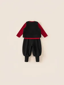 Kids three-piece winter outfit featuring red top, black fleece vest, and trousers