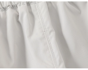 Detailed macro view of elastic waistband and neat double-needle stitching on kids cargo pants