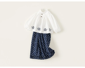 Detailed embroidery on white girls shirt with floral wide-leg pants child set